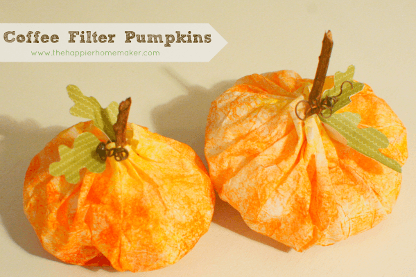 A close up of a two coffee filter pumpkins