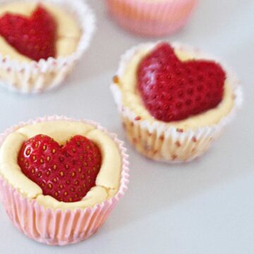 mini cheesecakes with strawberry hearts on top