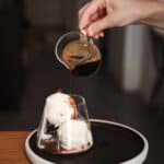 espresso pouring over ice cream to make affogato