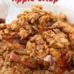 text reading peanut butter apple crisp over photo of spoon scooping up the crisp