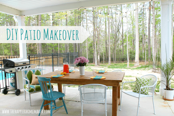 A DIY patio makeover with a wood table, white and blue chairs