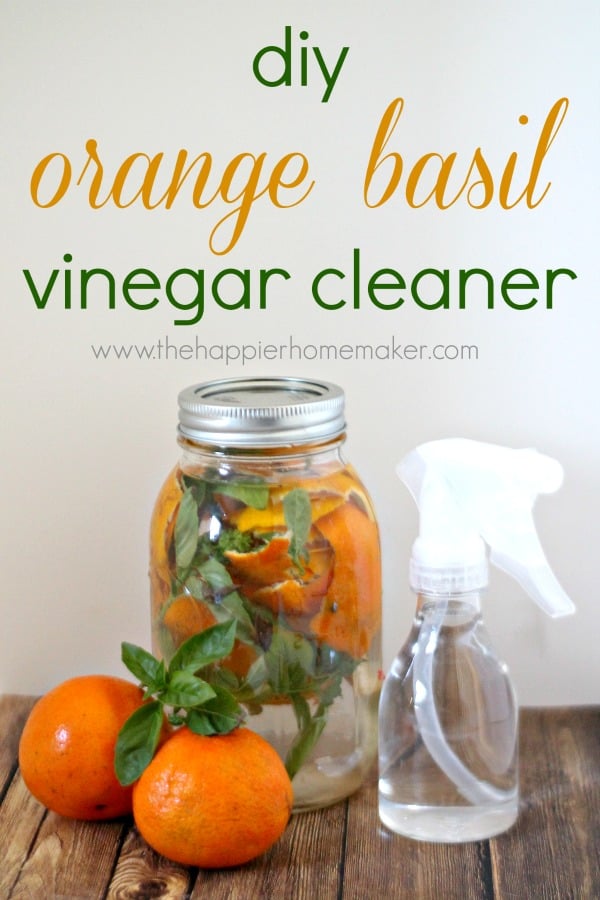 DIY orange and basil vinegar cleaner in a clear mason jar