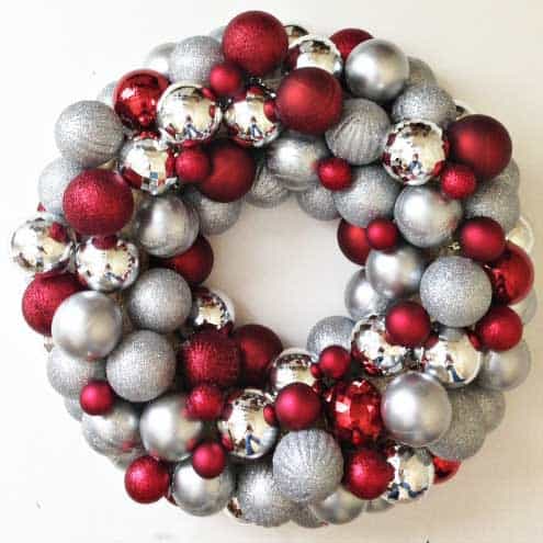easy DIY ornament wreath can be made for as little as $20, much less expensive than store bought versions and easy to create custom colors!
