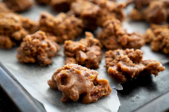 close up of easy microwave pralines on parchment paper