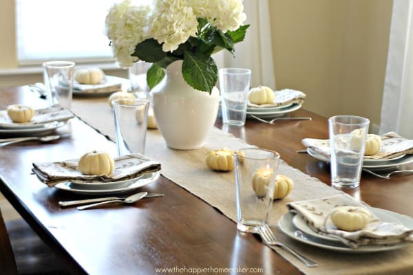 A Thanksgiving table setting with white hydrangea flowers