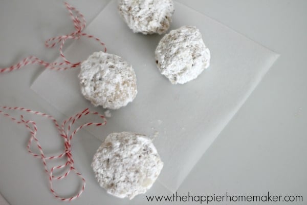 pecan snowball cookies covered in powdered sugar