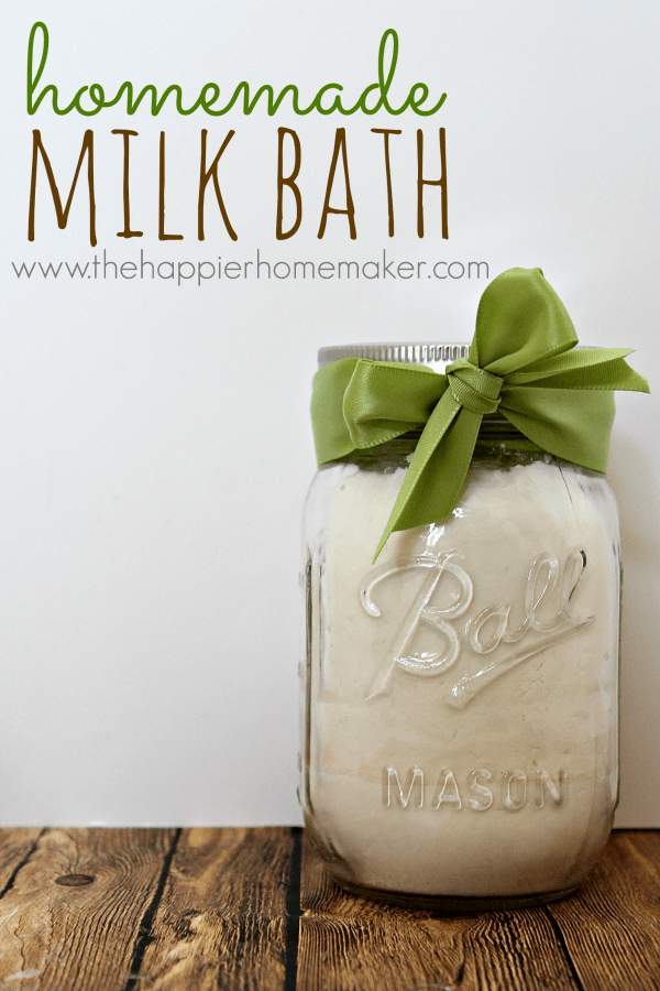 A mason jar with homemade milk bath topped with a green ribbon