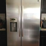 A stainless steel refrigerator in a kitchen