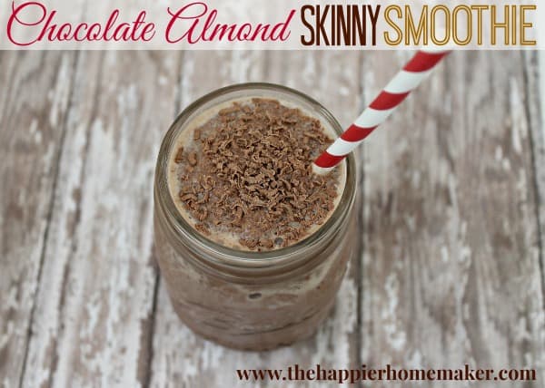 A close up of chocolate almond skinny smoothie in a mason jar with a red and white straw