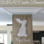 A white cut out of an Easter bunny on a burlap banner with the words "Happy Easter" underneath of it