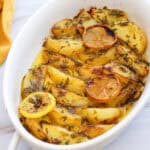 white baking dish with Greek lemon potatoes
