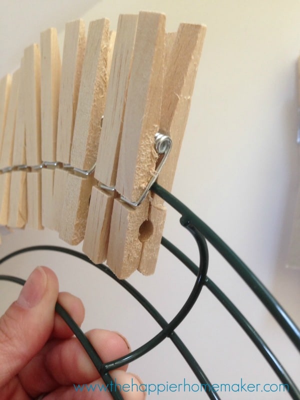 close up of clothespins on a wire wreath form