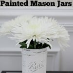 white painted mason jar with white mums