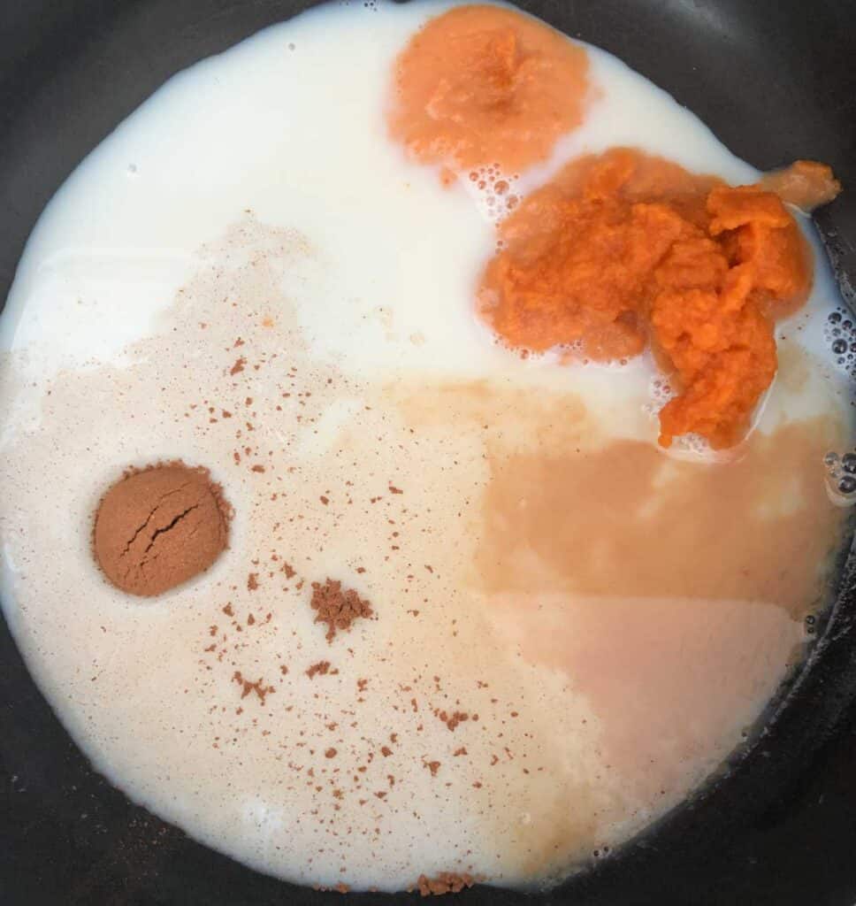pumpkin spice latte ingredients in saucepan
