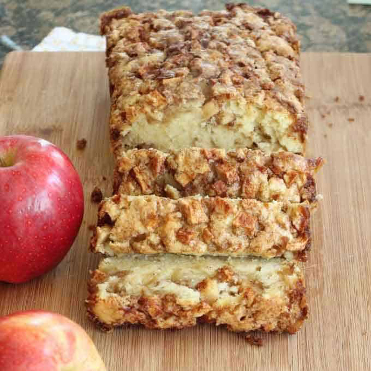 sliced apple bread on cutting board