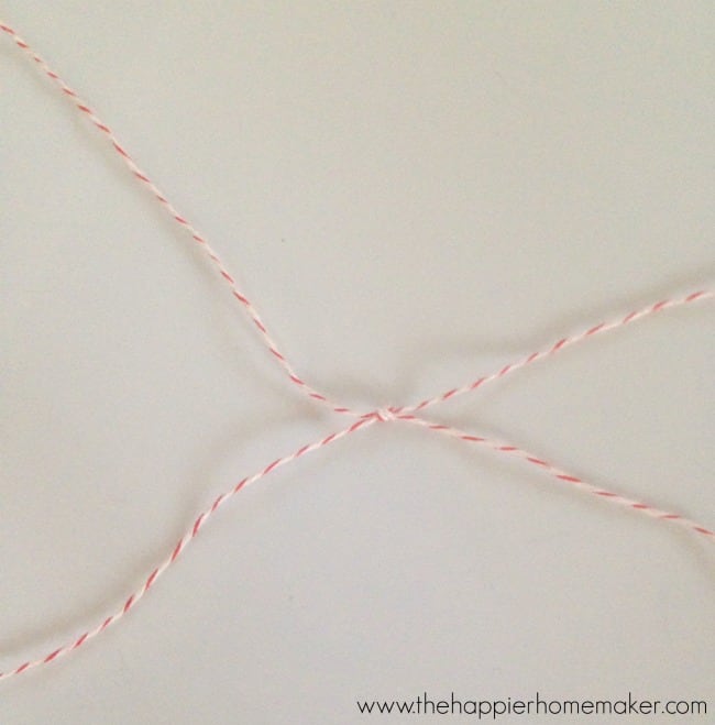 tied pieces of red and white twine