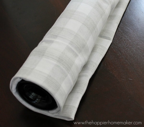 wrapping wine bottle in tea towel for gift