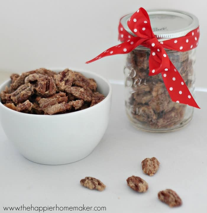 A bowl and jar of cinnamon sugared pecans