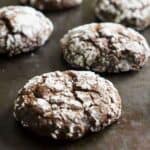 chocolate crinkle cookies on baking sheet