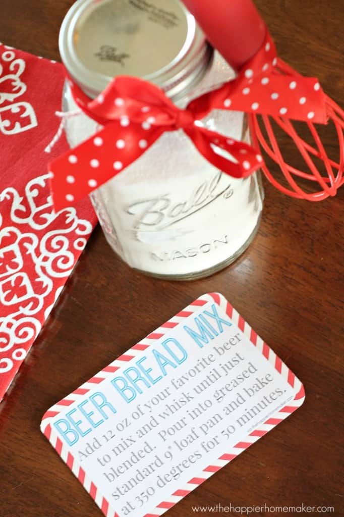 A mason jar filled with beer bread mix next to the baking instructions 