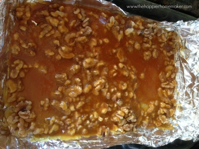 toffee spread on foil line baking sheet before hardening