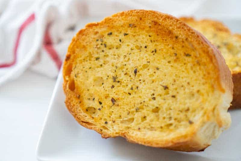 close up of slice of Texas toast on white plate