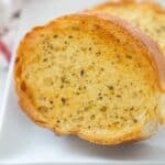 A close up of Texas toast slices on white plate