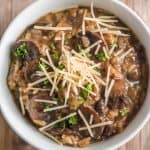 mushroom risotto in white bowl