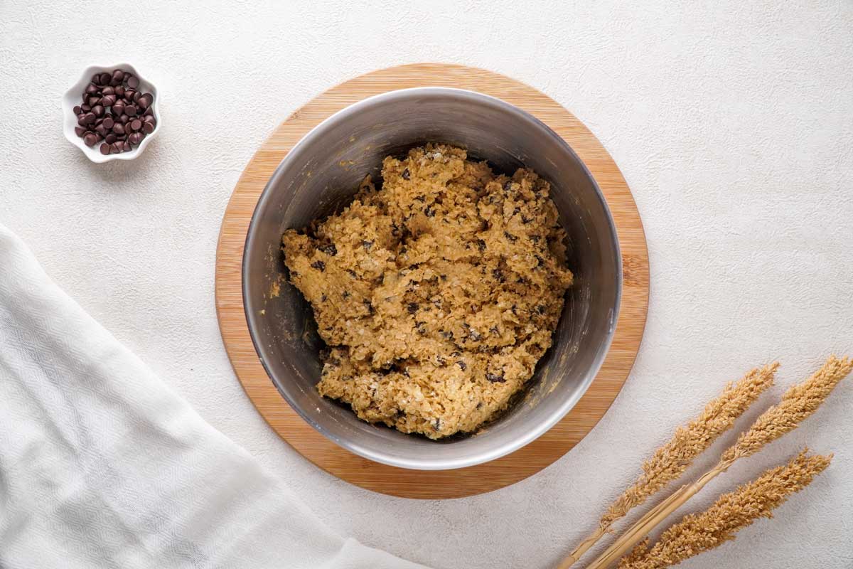 overhead view of chocolate chip oatmeal cookie dough in bowl