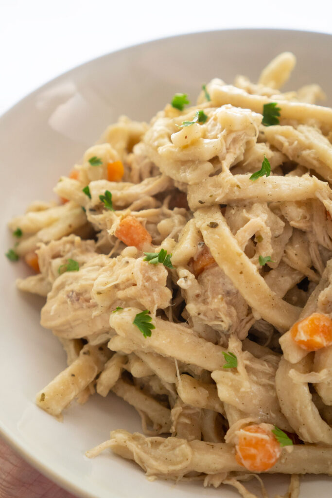 Reames chicken and noodles on white plate