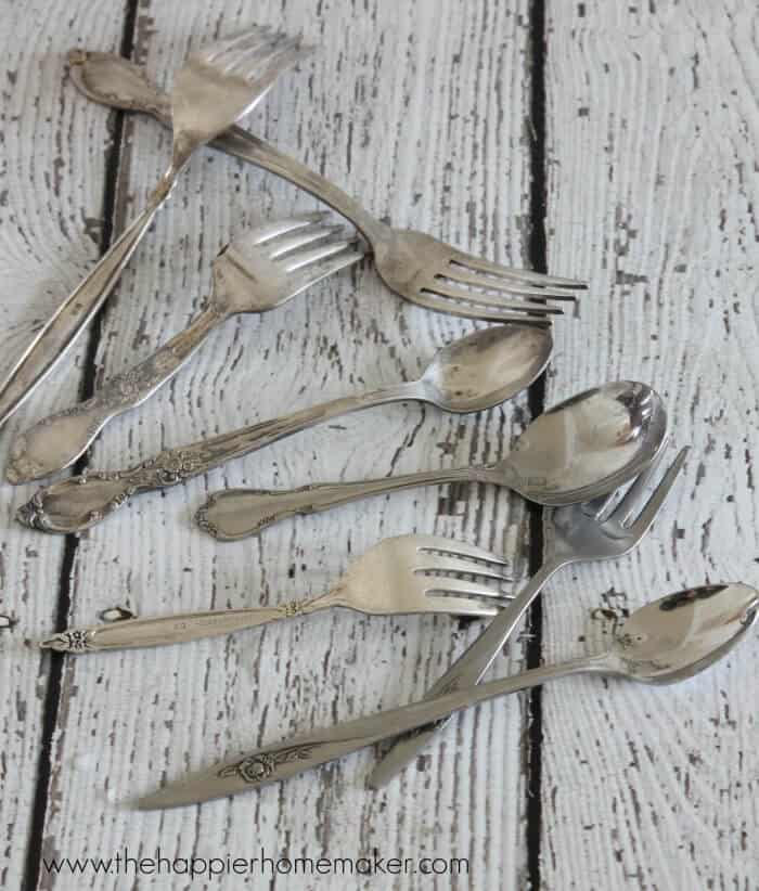 Assorted tarnished silver forks and spoons