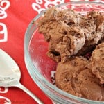 A close up of chocolate peanut butter ice cream on a red and white napkin