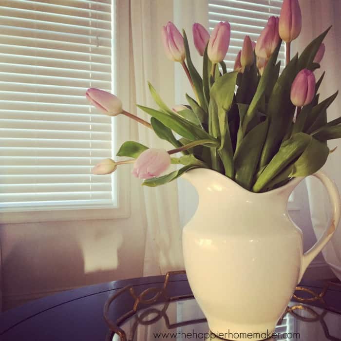 drooping tulips in wide vase