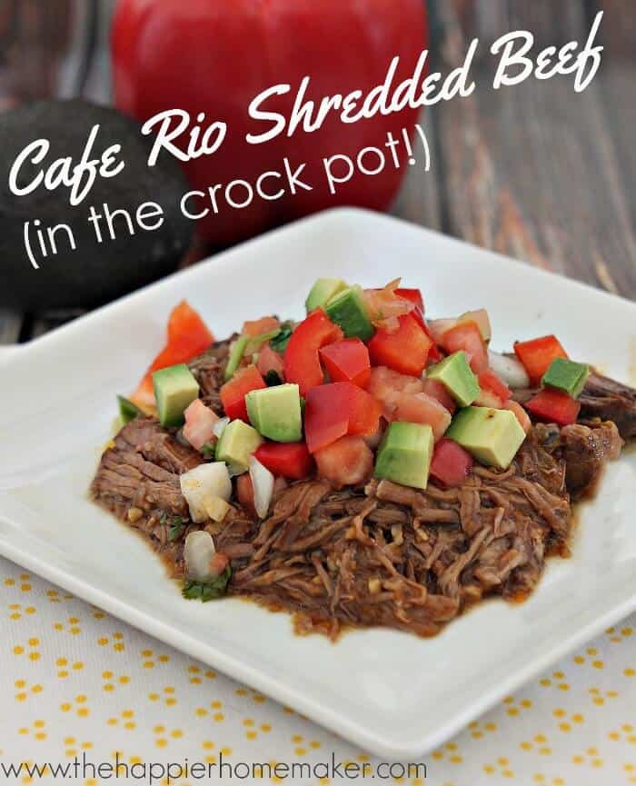 shredded beef topped with diced peppers and avocado on a white plate