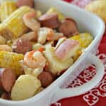 low country boil in white casserole dish