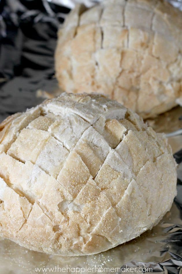 An in-process picture of someone making pesto cheesy pull apart bread