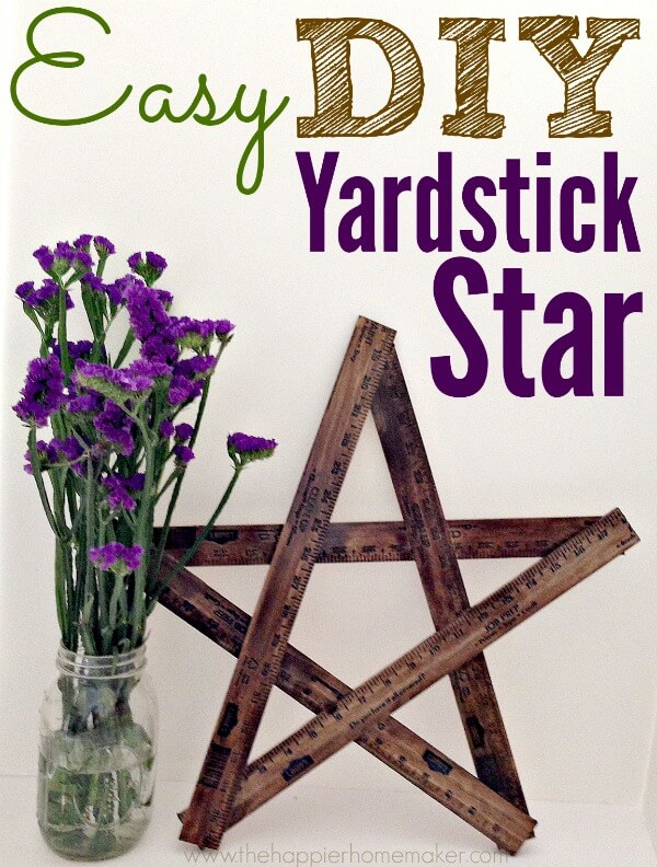 A DIY yardstick star next to flowers
