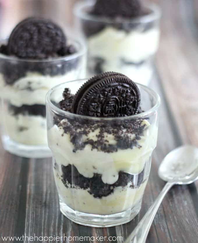 A cup of dirt cake topped with an Oreo