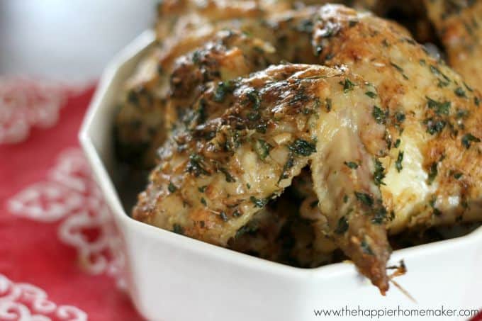 herbed chicken wings in white serving dish