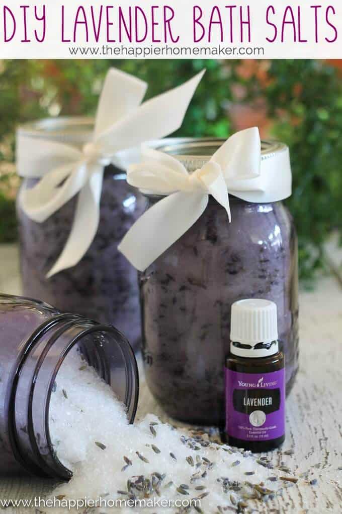 Three jars of lavender bath salts with lavender oil in front of them