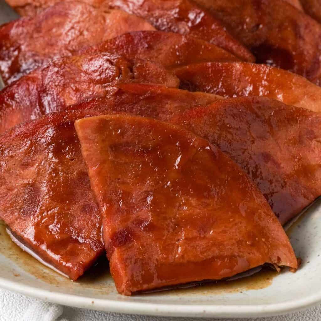 https://thehappierhomemaker.com/wp-content/uploads/2015/12/close-up-glazed-slow-cooker-ham-1024x1024.jpg