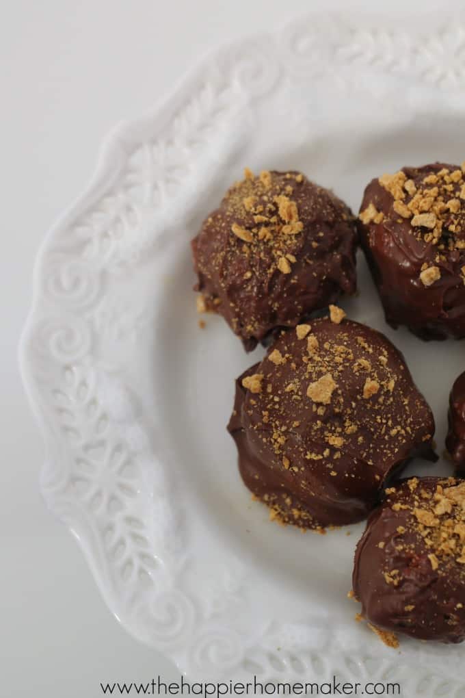 A close up of smores truffles on a white serving dish