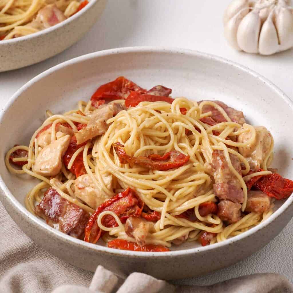 Tuscan chicken pasta in bowl