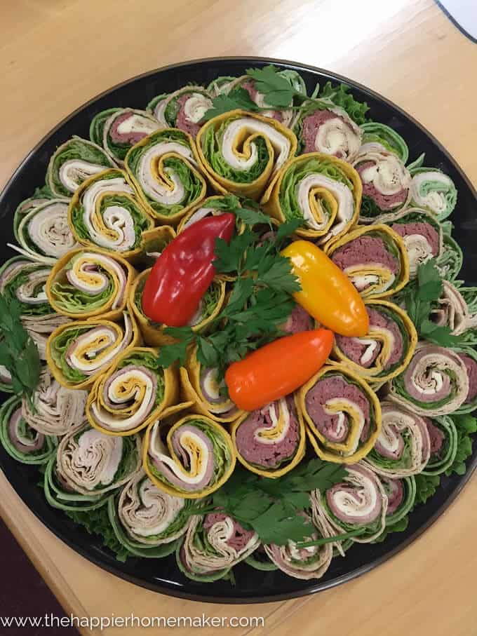 A close up of lunch wraps topped with colorful peppers