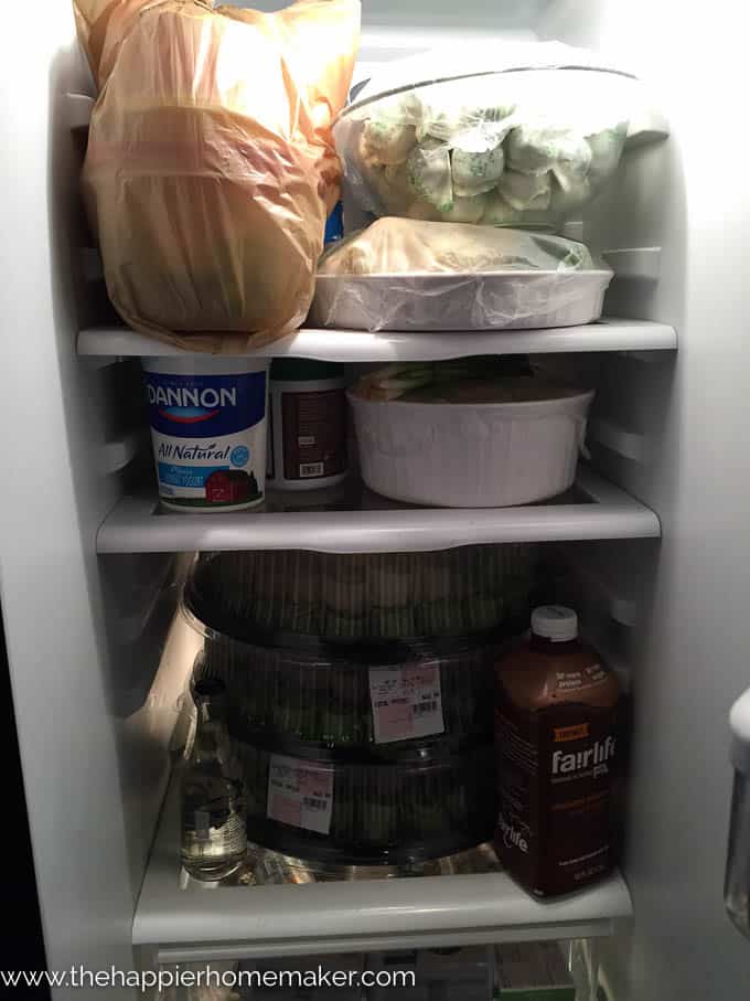 A refrigerator filled with food before a party