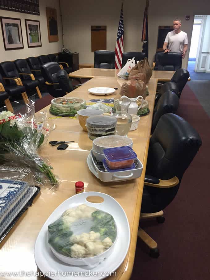 A conference table set up for snacks for a promotion party