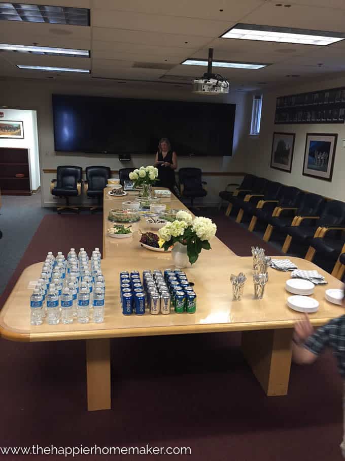 A conference table set up for snacks for a promotion party