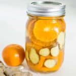 mason jar with orange and ginger slices