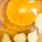 collage of orange and ginger simmer pot in mason jar