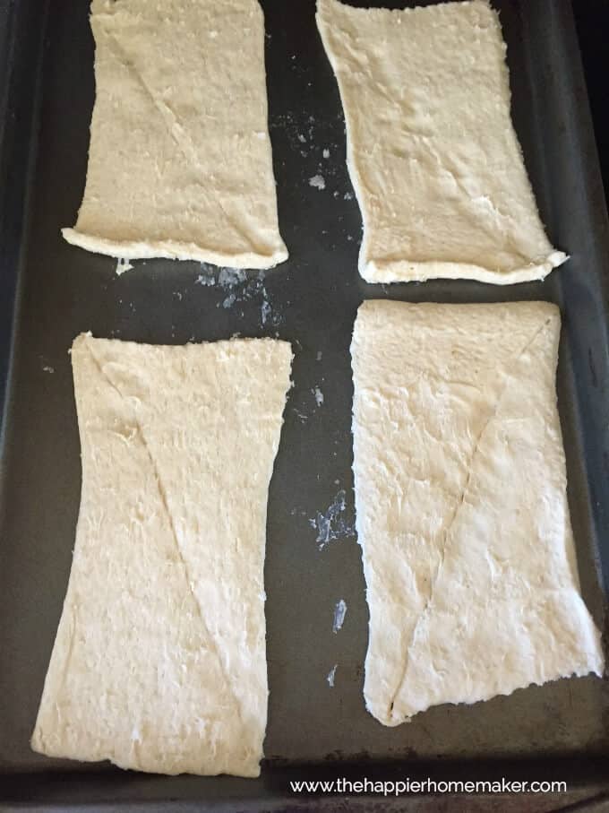 An in-process picture of preparing sloppy joe pockets with the dough ready for the sloppy joe